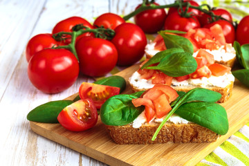 Bruschetta with spinach and cherry tomatoes on toasted baguette