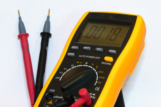 Digital multimeter with test leads connected  - isolated on white background