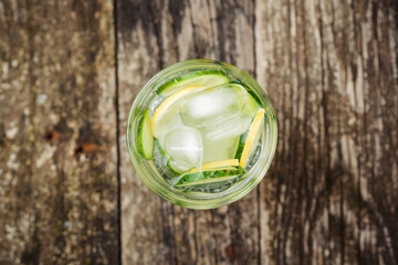 Detox water with cucumber and lemon .