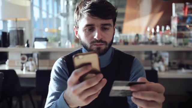     a guy a paid for online shopping with a bank card 