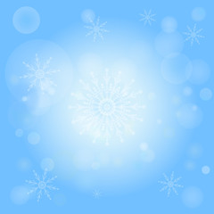Winter bokeh abstract light background with snowflakes.