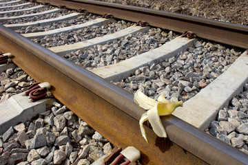 Banana peel on rail way, Humoristic 