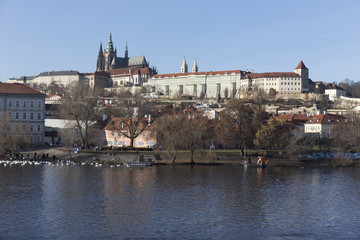 Fototapeta na wymiar Autumn Lesser Town of Prague with gothic Castle above River Vltava, Czech Republic