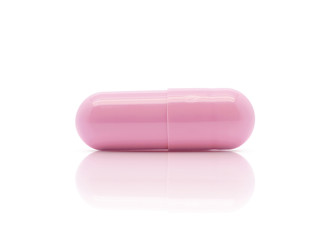 pink medicine capsule isolated on white background