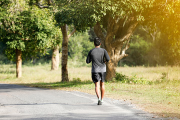 soft focus of Running men asian runner jogging during outdoor on