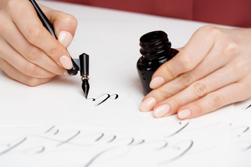 Girl writing calligraphy on postcards. Art design.