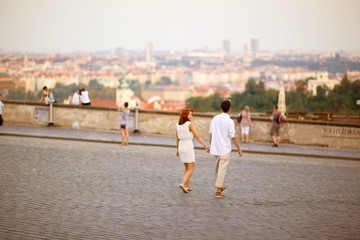 Fototapeta premium Young couple walking in old town of Prague