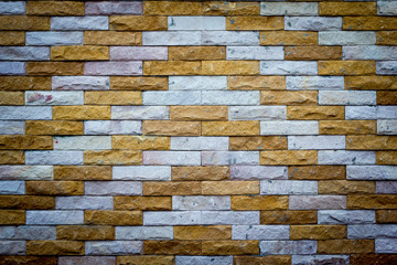 Brick wall background.dimly lit old brick wall