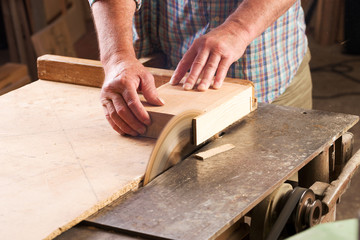 Carpenter tools on wooden table with sawdust. Circular Saw.