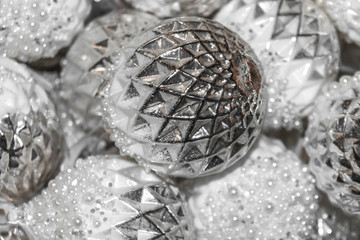 Silver Christmas tree balls. Decorations for the Christmas celebration. Balls and toys for Christmas tree. Merry Christmas and happy New Year!