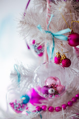 The pink balls hang on the Christmas Tree