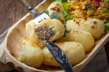 Potato dumplings stuffed with minced meat.