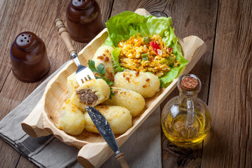 Potato dumplings stuffed with minced meat.