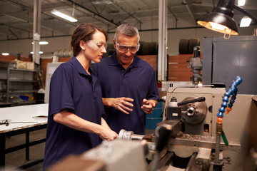 Engineer Training Female Apprentice On Milling Machine