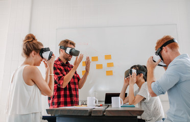 Team developers testing virtual reality headset