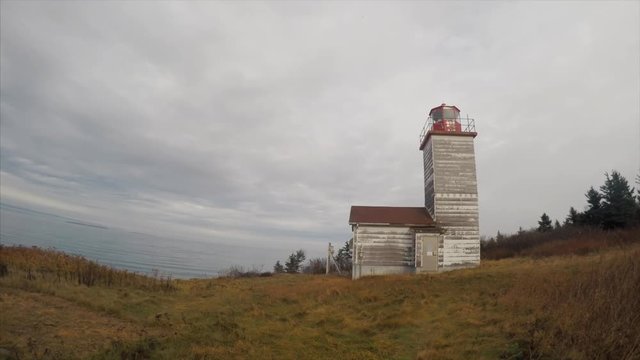 Panning time-lapse from lighthouse to ocean in Canada