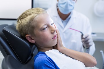 Unhappy young patient having a toothache
