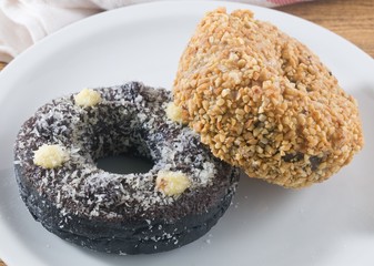 Dish of Fresh Chocolate Donut and Peanuts Donut