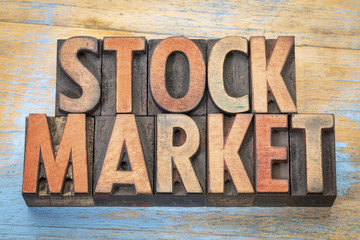 stock market text in wood type