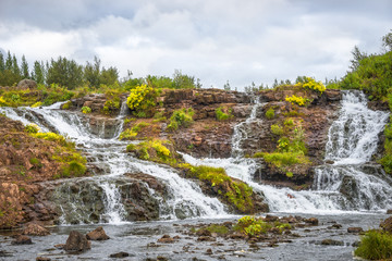 Wonderful waterfal in Iceland in Autumn colors