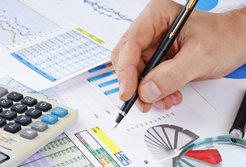 pen in hand and working paper