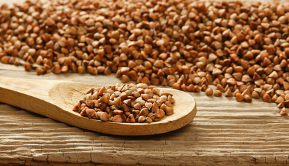 buckwheat groats and wooden spoon