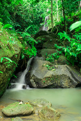 A stream of a waterfall into a river