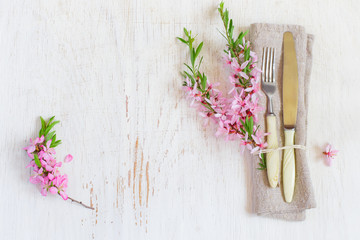 table setting with flowering almonds.Top view with copy space