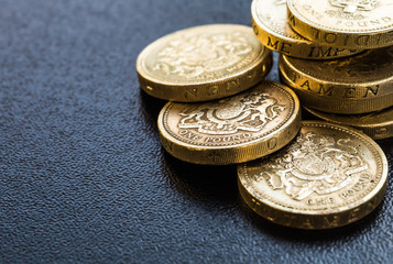 British coins stack on black, pound sterling