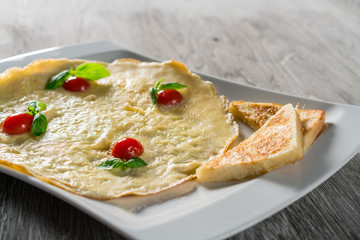 English Omelette with Tomatoes on Table