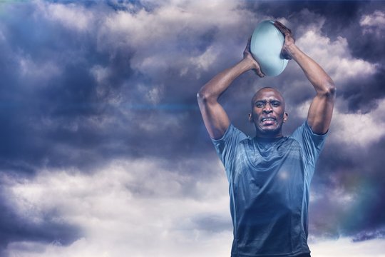 Composite image of determined sportsman throwing rugby ball 3D