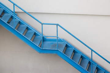 Fototapeta premium blue steel stair outside of building for fire exit