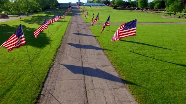 Before the parade, American Flags line cemetery road on Memorial Day.
