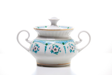 Sugar bowl on white background. Tea time. Porcelain dishes. 