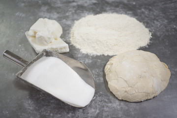 close up of industrial bakery ingredients a large metal scoop fi