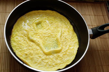 homemade scrambled eggs in a frying pan