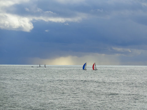 Sailing boats in the sea, sky with clouds