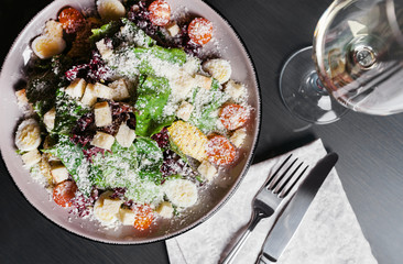 Salad with chicken, mozzarella and cherry tomatoes. Top view