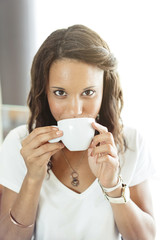 young woman drinking a coffee