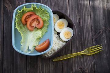 
healthy food in the container - rice, eggs, vegetables