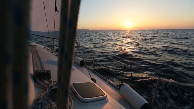 Amazing sunset at sea on a sailing yacht.