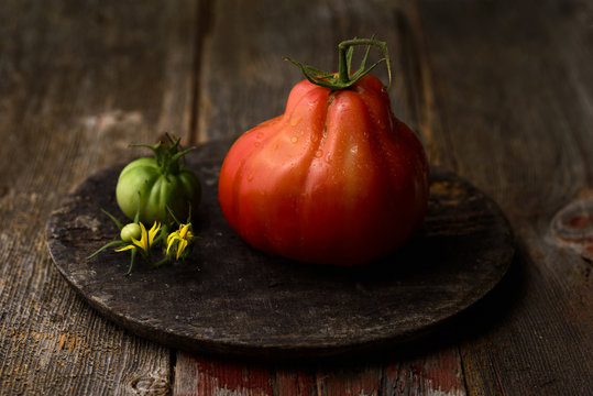 Heirloom tomatoes on wooden board, still life