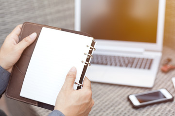 Bussiness Concept, Bussiness man reading notebook with laptop an