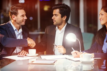 Businessman shaking hands with colleague