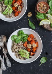 Quinoa and pumpkin bowl. Vegetarian, healthy, diet food. On a dark background, top view