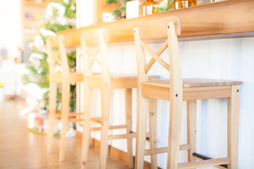 Interior stool chair with vintage bar in light flare. Soft focus over lighting with flares lights.