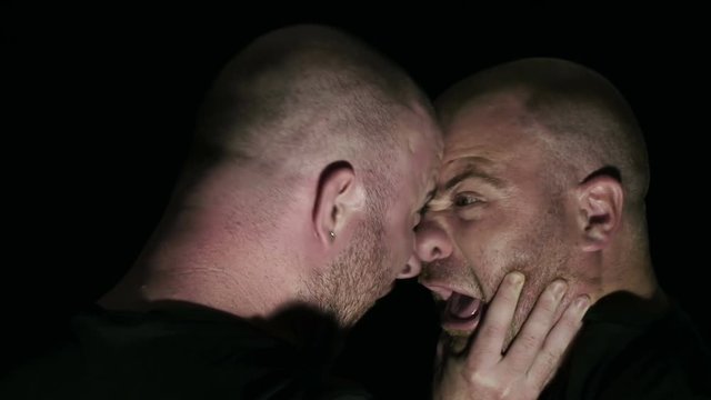 two guys yelling at each other and are going to beat in the dark