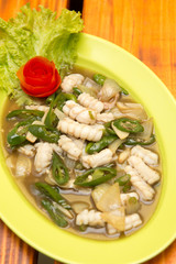 Squid cuisine served with spicy sour filling sauce, green sweet chili, and onion.