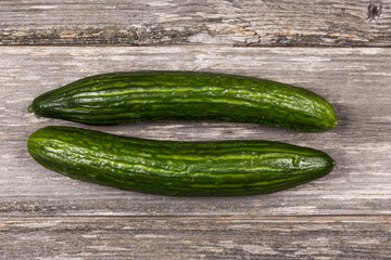 Cucumbers on gray board/Close up of two cucumbers on gray board