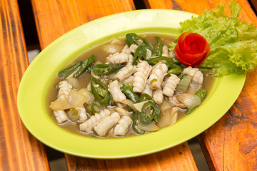 Squid cuisine served with spicy sour filling sauce, green sweet chili, and onion.